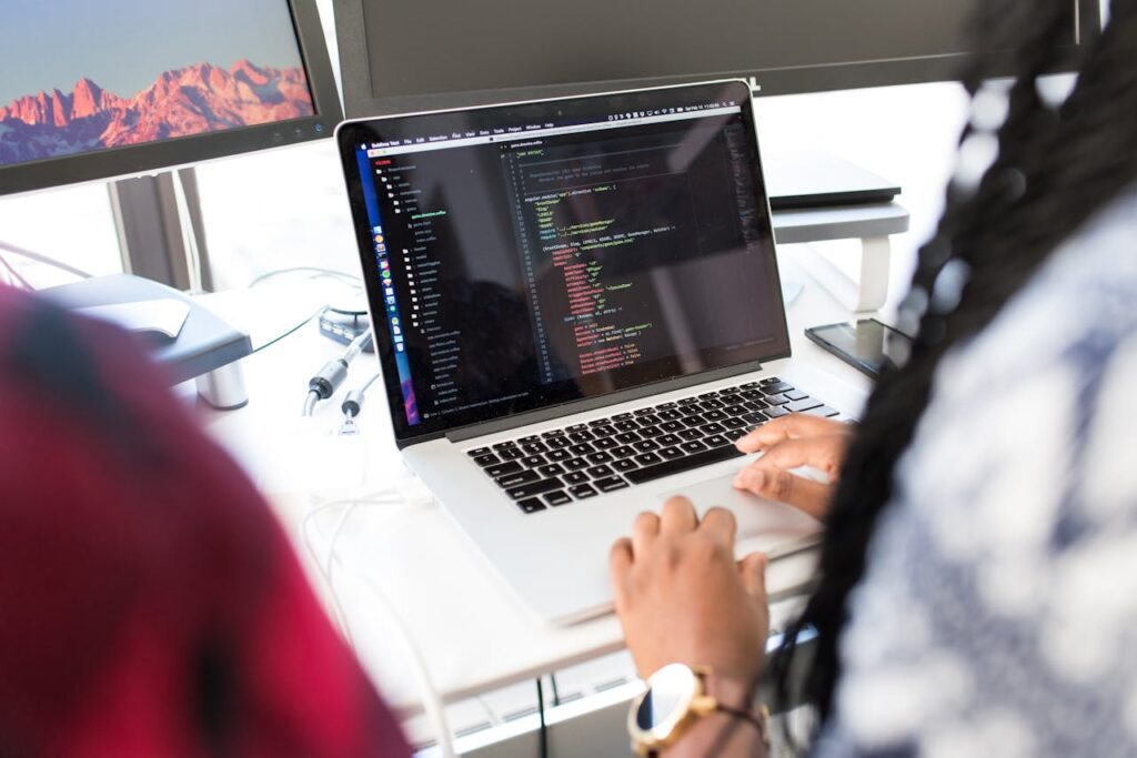 Person Using Silver Macbook Pro